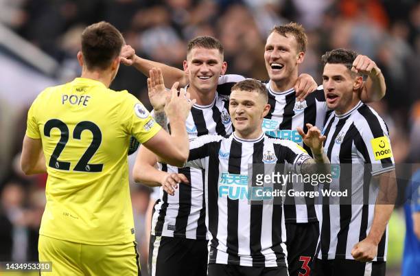Nick Pope of Newcastle United joins in with the celebrations as team mates Sven Botman, Kieran Trippier, Dan Burn and Fabian Schar celebrates their...