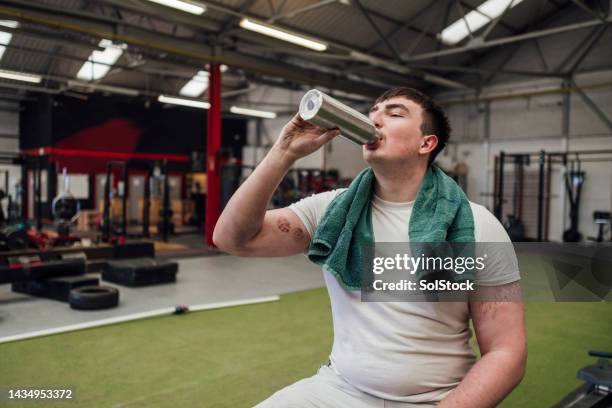 hydrating himself - holding bottle stock pictures, royalty-free photos & images