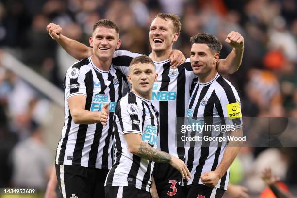 Sven Botman, Kieran Trippier, Dan Burn and Fabian Schar of Newcastle United celebrate their side's win after the final whistle of the Premier League...