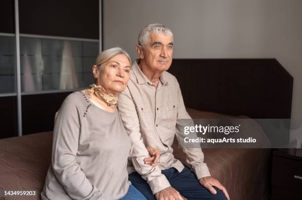 contemplative senior couple at home - old turkish woman stock pictures, royalty-free photos & images
