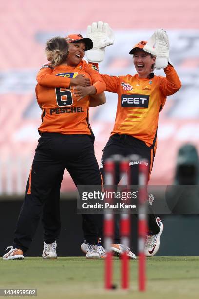 Taneale Peschel of the Scorchers celebrates the wicket of Jemimah Rodrigues of the Stars with Alana King and Beth Mooney during the Women's Big Bash...