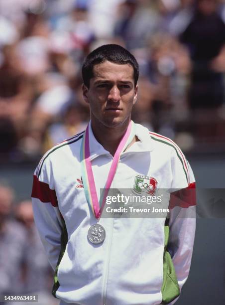 Francisco Maciel from Mexico stands on the podium after receiving the silver medal as runner up to Stefan Edberg in the Men's Tennis Singles test...