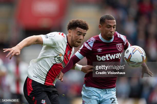 Che Adams of Southampton and Thilo Kehrer of West Ham United during the Premier League match between Southampton FC and West Ham United at Friends...