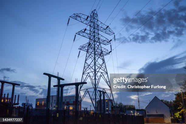 Insulators on an electricity sub station are seen near homes on October 19, 2022 in Manchester, England. The British utility company, National Grid,...