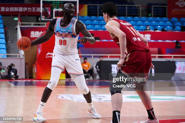 Tacko Fall of Xinjiang Flying Tigers drives the ball during 2022/2023 Chinese Basketball Association League match between Xinjiang Flying Tigers and...