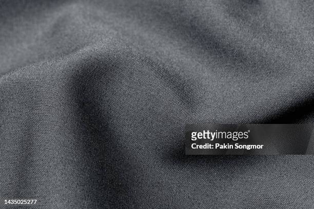 black color fabric cloth polyester texture and textile background. - dark clothes stock pictures, royalty-free photos & images
