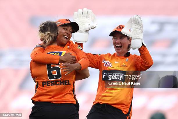 Taneale Peschel of the Scorchers celebrates the wicket of Jemimah Rodrigues of the Stars with Alana King and Beth Mooney during the Women's Big Bash...