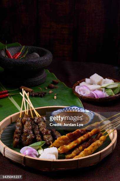 malaysian and indonesian street food "satay". - chicken skewers stockfoto's en -beelden
