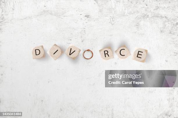 divorce message in wooden letters.white surface - alimony imagens e fotografias de stock