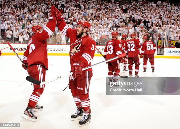 Keith Yandle and Mikkel Boedker of the Phoenix Coyotes celebrate after an overtime victory against the Nashville Predators in Game One of the Western...