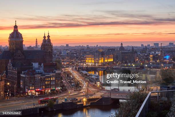 amsterdam cityscape at sunset - amsterdam aerial stock pictures, royalty-free photos & images