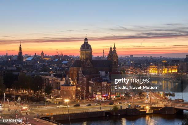 aerial view cityscape at sunset in amsterdam, the netherlands - amsterdam sunset stock pictures, royalty-free photos & images