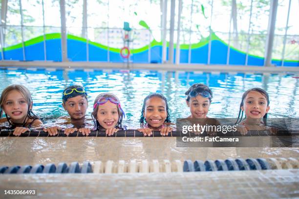 children in a public swimming pool - children only diversity stock pictures, royalty-free photos & images