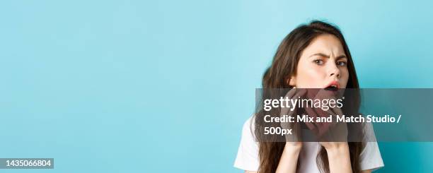 skin care image of worried teenage girl looking in mirror and spot a - make up looks stock pictures, royalty-free photos & images
