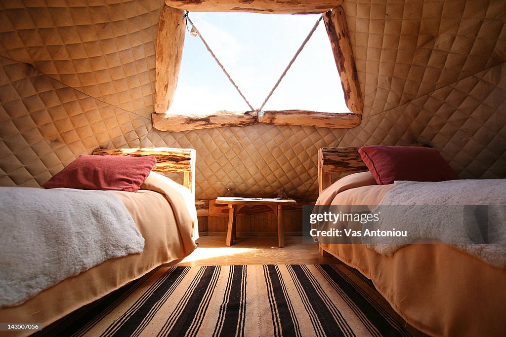 Inside view of domed cabin with two beds