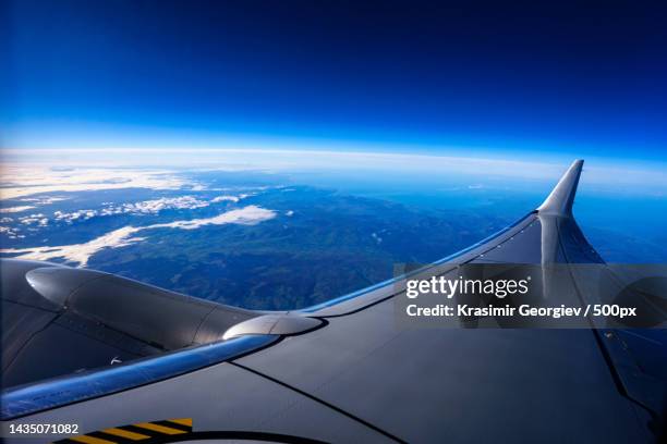 cropped image of airplane wing flying over landscape against sky,dublin,ireland - krasimir georgiev stock pictures, royalty-free photos & images