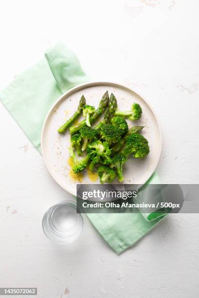 overhead view of steames broccoli and asparagus - plain salad stock pictures, royalty-free photos & images