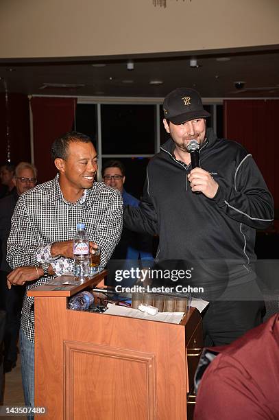 Professional poker players Tiger Woods and Phil Hellmuth participate in Tiger's Charity Poker Night during Tiger Jam 2012 at the Mandalay Bay Resort...