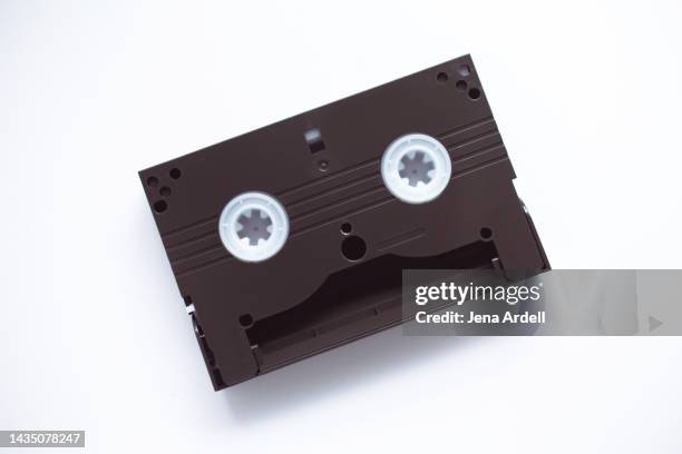 anthropomorphic face on mini vhs cassette tape, vhs-c video tape - アナログ ストックフォトと画像
