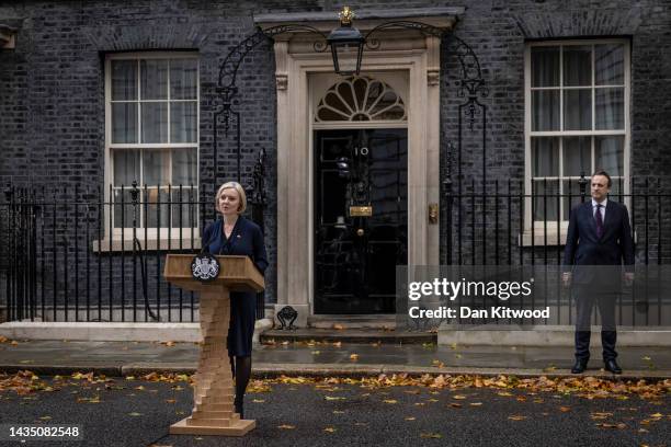 Liz Truss speaks in Downing Street, with husband Hugh O'Leary, as she resigns as Prime Minister Of The United Kingdom on October 20, 2022 in London,...