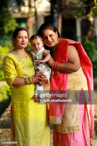 indian family portrait together outdoor in park - indian aunt stock pictures, royalty-free photos & images