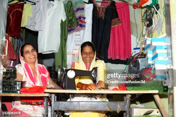 female tailor stitching clothes portrait together - seam stock pictures, royalty-free photos & images