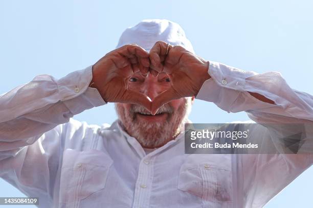 Brazil's former president and current presidential candidate Luiz Inacio Lula da Silva greets supporters during a rally in Sao Gonçalo in the Baixada...