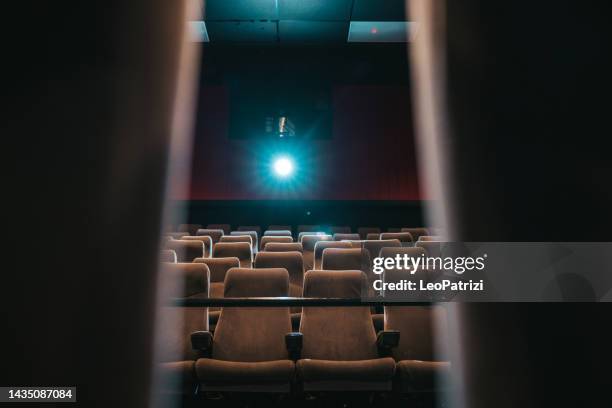 movie theater grey seats in a modern cinema - projectieapparatuur stockfoto's en -beelden