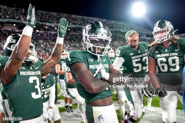 Jayden Reed of the Michigan State Spartans reacts after making the game-winning reception against the Wisconsin Badgers in double overtime at Spartan...