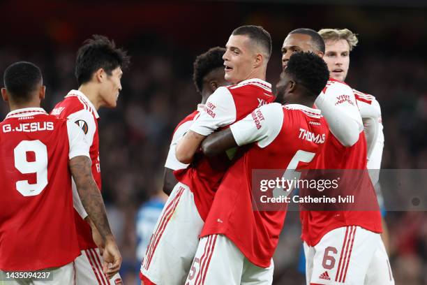 Granit Xhaka of Arsenal celebrates with teammate Thomas Partey after scoring their side's first goal during the UEFA Europa League group A match...