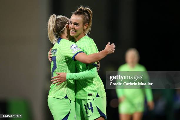 Jill Roord of VfL Wolfsburg celebrates with team mate Kristin Demann after scoring their sides fourth goal during the UEFA Women's Champions League...