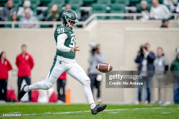 Bryce Baringer of the Michigan State Spartans punts the ball against the Wisconsin Badgers at Spartan Stadium on October 15, 2022 in East Lansing,...