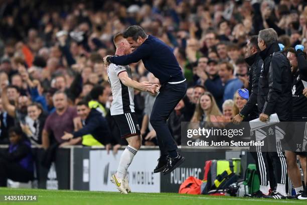 Harrison Reed of Fulham celebrates with Marco Silva, Manager of Fulham after scoring their sides first goal during the Premier League match between...