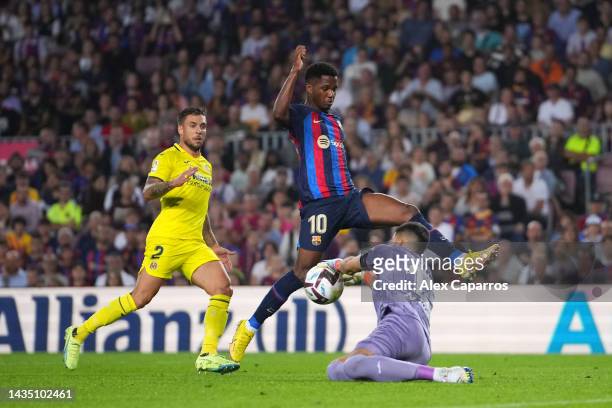 Ansu Fati of FC Barcelona is challenged by Geronimo Rulli of Villarreal CF during the LaLiga Santander match between FC Barcelona and Villarreal CF...
