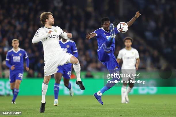 Daniel Amartey of Leicester City controls the ball whilst under pressure from Patrick Bamford of Leeds United during the Premier League match between...