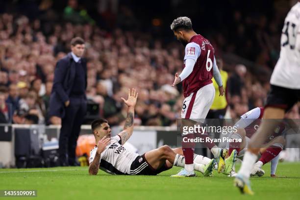 Aleksandar Mitrovic of Fulham is fouled by Douglas Luiz of Aston Villa leading to a red card decision during the Premier League match between Fulham...