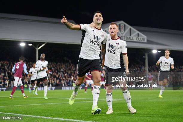 Aleksandar Mitrovic of Fulham celebrates with team mate Harrison Reed after scoring their sides second goal from the penalty spot during the Premier...