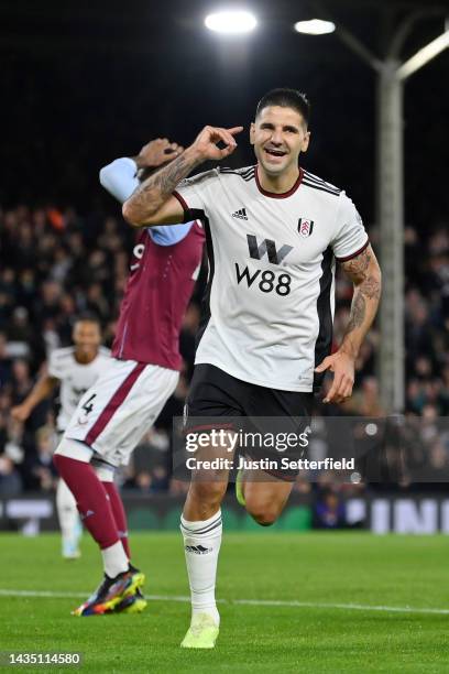 Aleksandar Mitrovic of Fulham celebrates after scoring their sides second goal from the penalty spot during the Premier League match between Fulham...