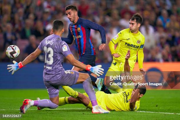 Ferran Torres of FC Barcelona competes for the ball with Geronimo Rulli of Villarreal CF during the LaLiga Santander match between FC Barcelona and...