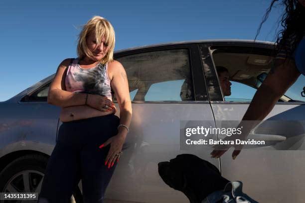 Ashley Hanson stays in a remote stretch of southern California desert on July 06 where at least 200 unhoused people live outside, battling the...