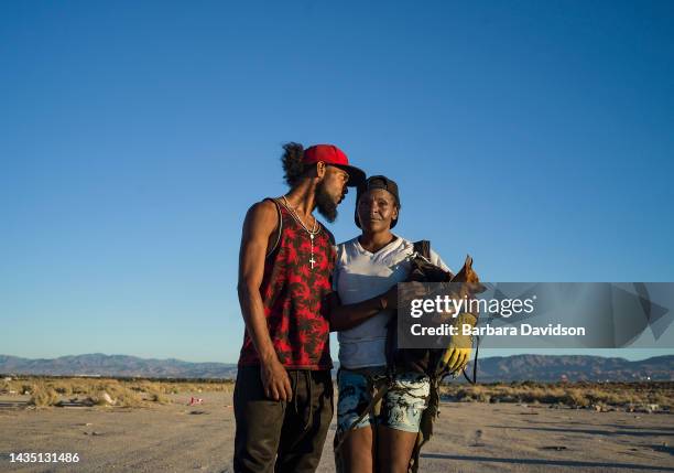 Candice Winfrey is pictured with her boyfriend and her dog, Titanium, on July 06, 2022. The 37-year-old lives in a camper in the Mojave Desert, on...