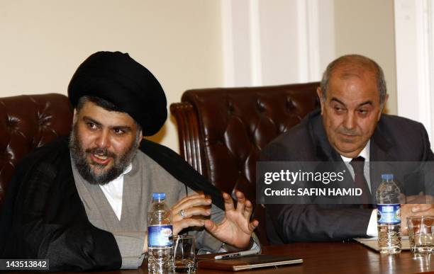 Iraqi Shiite cleric Moqtada al-Sadr and former premier Iyad Allawi attend a meeting of Iraqi leaders in Arbil, the capital of Kurdistan in northern...