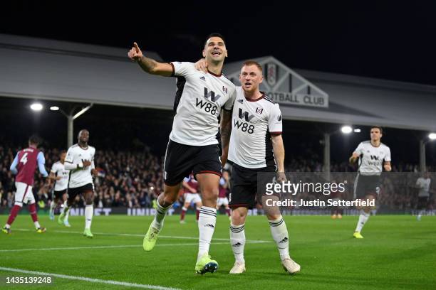 Aleksandar Mitrovic of Fulham celebrates with team mate Harrison Reed after scoring their sides second goal during the Premier League match between...