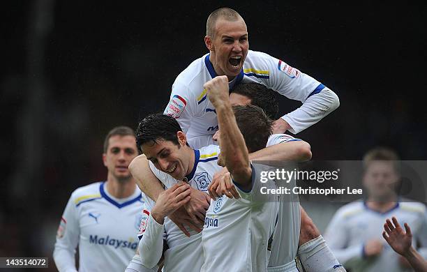 Peter Whittingham of Cardiff is congratulated by team-mates after scoring their first goal during the npower Championship match between Crystal...