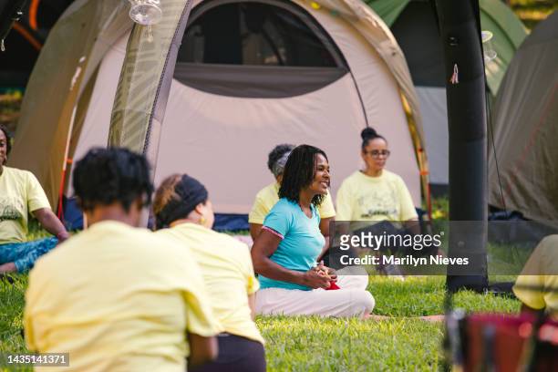 yoga instructor guiding the group - "marilyn nieves" stock pictures, royalty-free photos & images