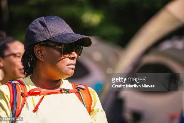 black women wearing sunglasses looking pensive - "marilyn nieves" stock pictures, royalty-free photos & images
