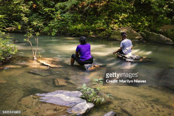 wading in the river while on a hike - "marilyn nieves" stock pictures, royalty-free photos & images