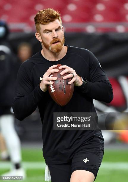 Quarterback Andy Dalton of the New Orleans Saints warms up prior to the game against the Arizona Cardinals at State Farm Stadium on October 20, 2022...
