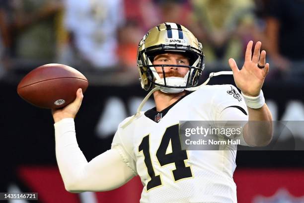 Quarterback Andy Dalton of the New Orleans Saints warms up prior to the game against the Arizona Cardinals at State Farm Stadium on October 20, 2022...