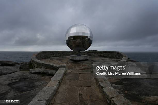 The sculpture titled 'Lens' by Joe Adler is seen at Sculpture By The Sea at Bondi Beach on October 21, 2022 in Sydney, Australia. Sculpture by the...